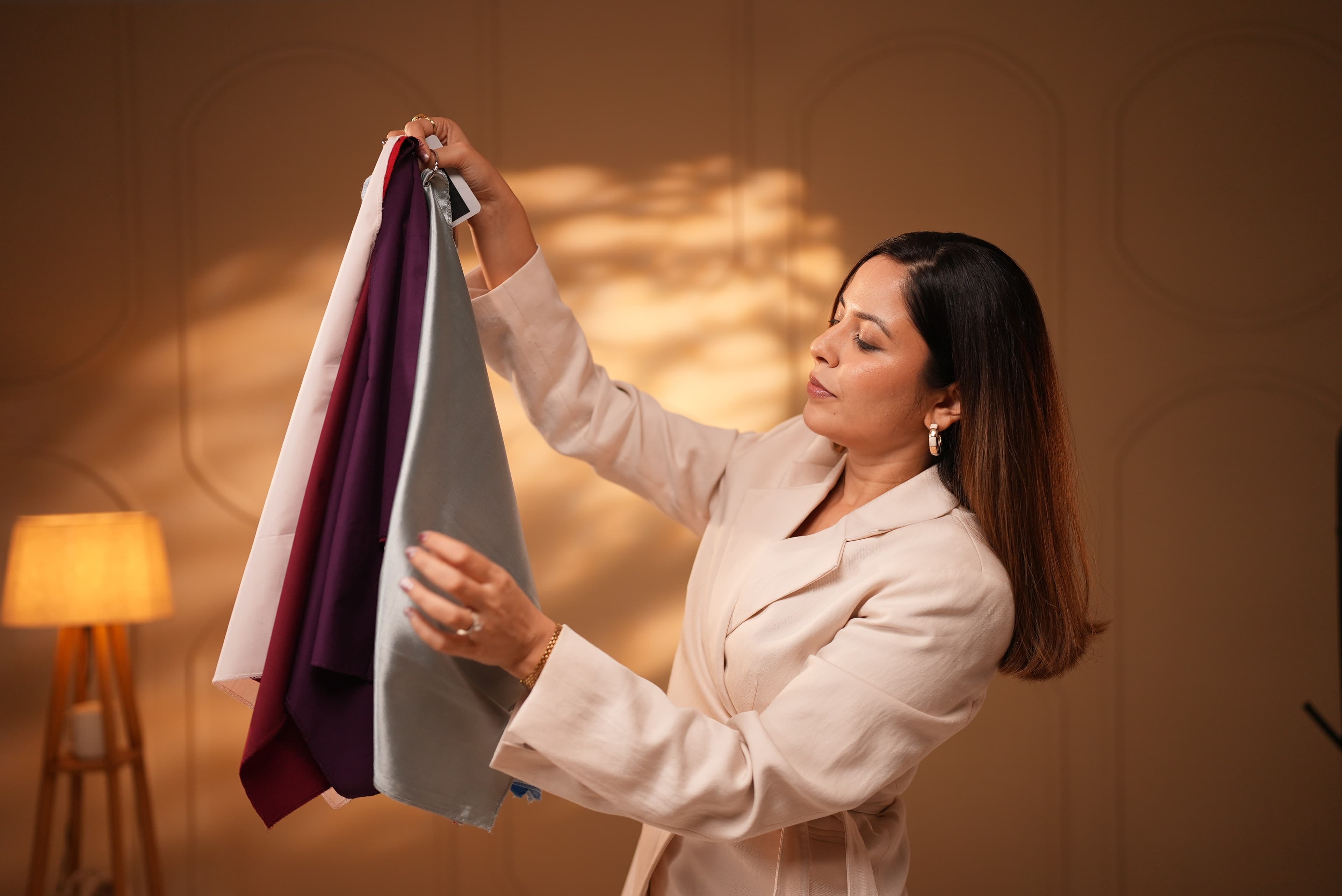 Stylist holding garments